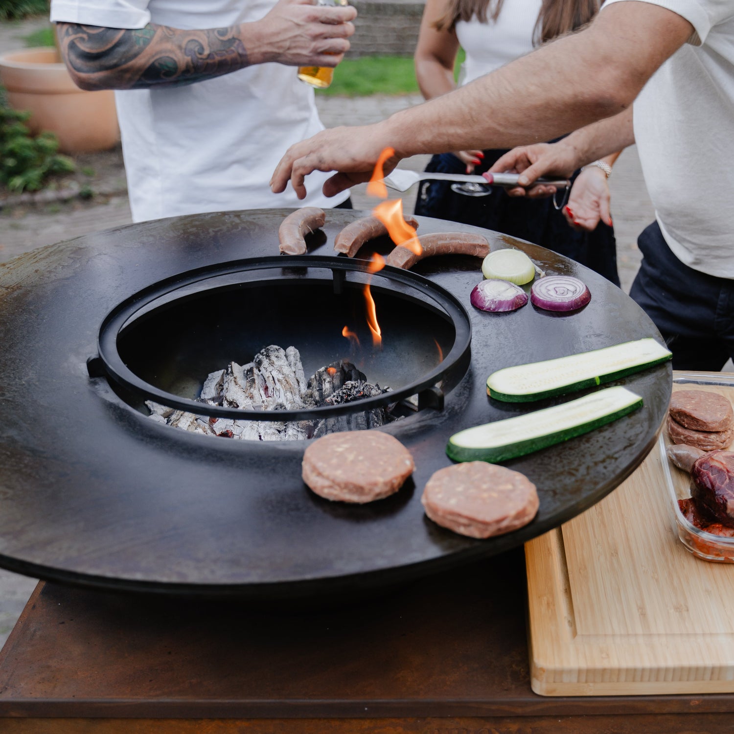 Hoe steek ik mijn vuurschaal BBQ Grill aan?