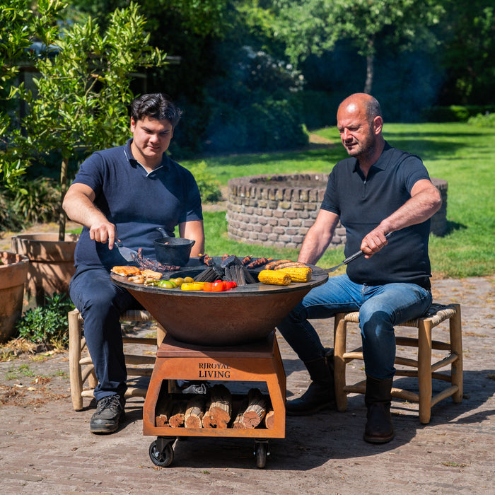 BBQ Vuurschaal Grill Brasero Vuurschaal Cortenstaal met grote wielen, houtopslag en bakplaat Ø80cm