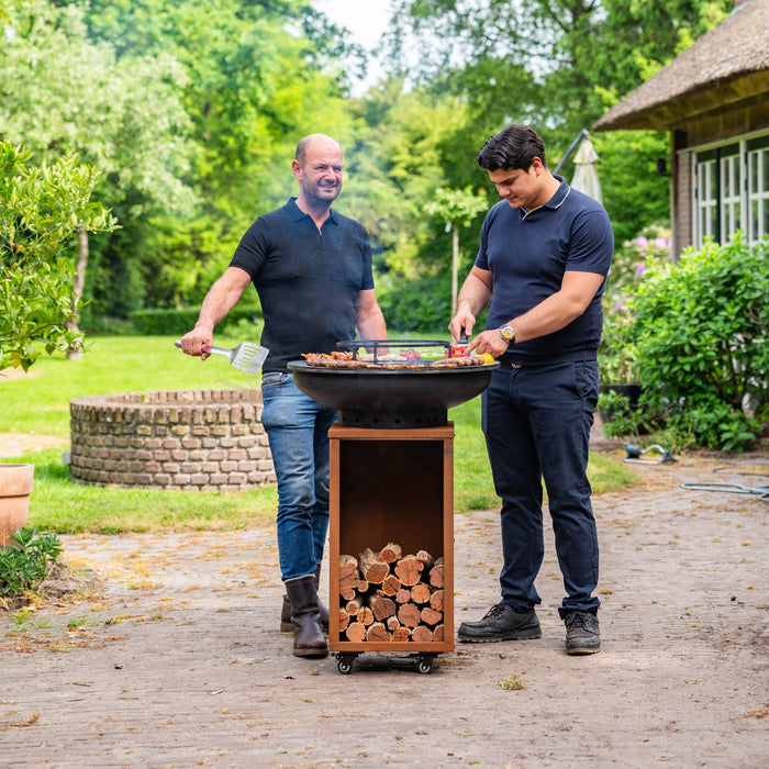 BBQ Vuurschaal Grill Blackline Cortenstaal 8mm Camarada 2.0 - Met pook en houtopslag Ø70cm